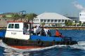 Tow boat going out