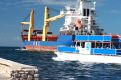 Pleasure boat and Tanker ship going out