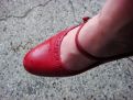 Foot in the red shoe